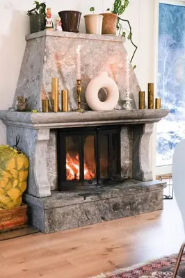 a fireplace in a living room with a fire place at Beautiful Private Villa with Lake View and Boat in Hålland