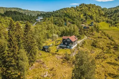 an aerial view of a house on a hill at Beautiful Private Villa with Lake View and Boat in Hålland