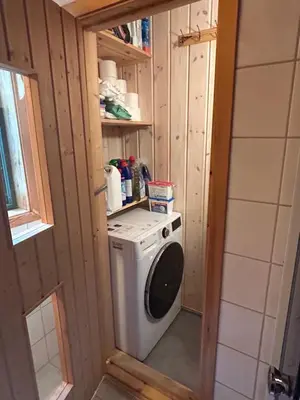 a washer and dryer in a tiny house at Cabin with a great view at Gaustablikk in Gaustablikk