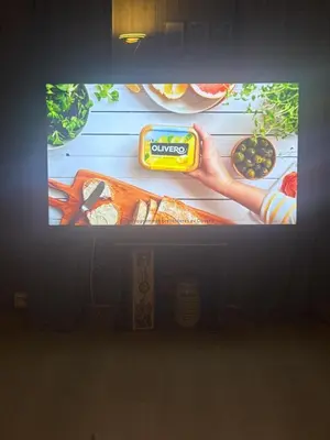 a television screen with a picture of food on it at Hytte med Anneks og fantastisk utsikt på Ljøsheim in Mesnali