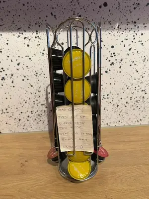 a wine rack with yellow wine glasses in it at Apartment Grønlid in Rauland