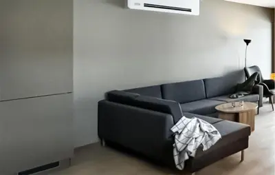 a living room with a blue couch and a table at 2 Bedroom Nice Apartment In Geilo in Geilo