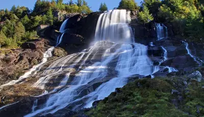 an aerial view of a waterfall on a mountain at Odda Living - 3BR & 1BR - A3 in Tokheim