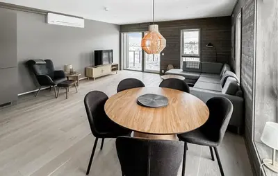 a living room with a wooden table and chairs at Awesome Apartment In Geilo With Sauna in Geilo