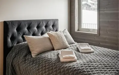 a large bed with two pillows on top of it at Awesome Apartment In Geilo With Sauna in Geilo