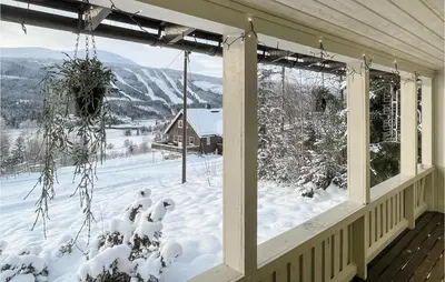 a porch with a view of a snow covered yard at Awesome Home In Trysil With Wifi in Trysil
