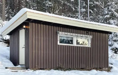 a small building in the snow with a window at Awesome Home In Trysil With Wifi in Trysil