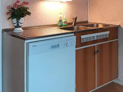a small kitchen with a sink and a dishwasher at 6 person holiday home in Åram-By Traum in Sandvik