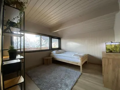 a small room with a bed and a window at Newly renovated apartment with a central location in Geilo