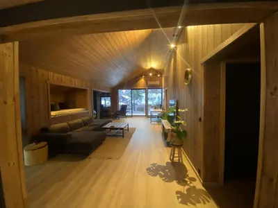 a living room with a couch and a fireplace at Newly renovated apartment with a central location in Geilo
