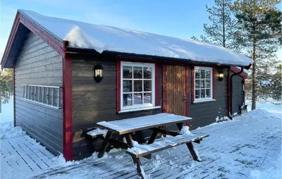 a small cabin with a picnic table in the snow at 5 Bedroom Pet Friendly Home In Jordet in Jordet