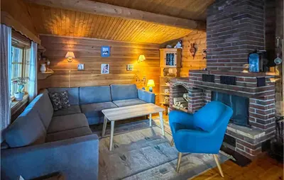 a living room with a couch and a fireplace at 5 Bedroom Pet Friendly Home In Jordet in Jordet
