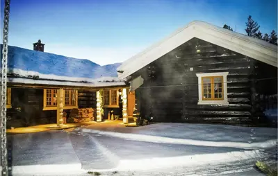 a log cabin with snow on the roof at Awesome Home In Hemsedal With Sauna in Hemsedal