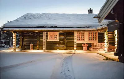 a log cabin with snow on the roof at Awesome Home In Hemsedal With Sauna in Hemsedal