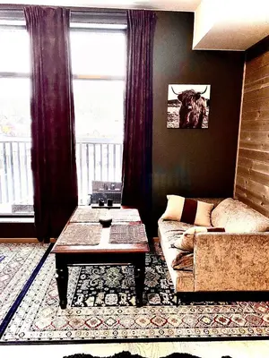 a living room with a couch and a coffee table at Topp studio leilighet Alpine Lodge in Trysil