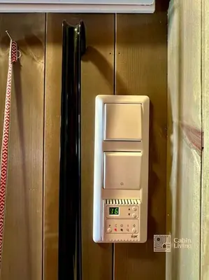 a microwave oven hanging on a wall at Cozy apartment ski in out, BBQ & Wifi Sjusjøen in Sjusjøen