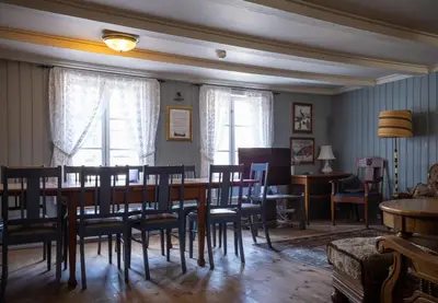 a dining room with a table and chairs at Bergmannsgata 3 in Røros