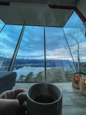 a room with a large glass window with a view at Engeset Trehytter in Vereide