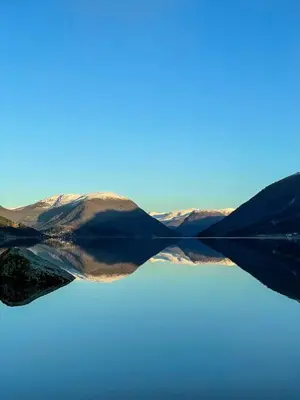 a view of a body of water with mountains at Engeset Trehytter in Vereide