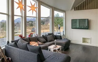 a living room with two couches and a tv at Lovely Home In Stadlandet in Stadlandet