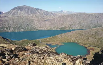 an aerial view of two lakes on a mountain at Bassebuupdalstøl in Tyinkrysset