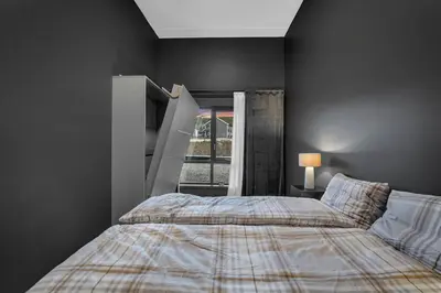 a bedroom with a bed and a window at New Nice apartment Trysil alpine lodge with the lift right outside in Trysil