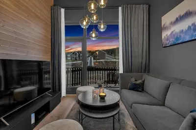 a living room with a couch and a table at New Nice apartment Trysil alpine lodge with the lift right outside in Trysil