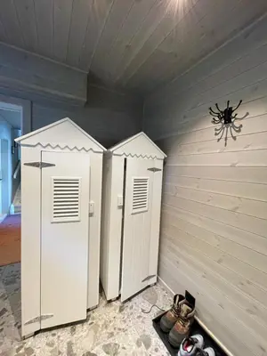 two refrigerators in a room with a spider on the wall at Villa Blue Dream in Kristiansund
