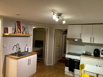 a kitchen with white cabinets and a sink at Trondheim, Kroppanmarka Tiller in Trondheim