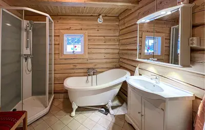 a bathroom with a tub and a sink and a shower at 3 Bedroom Gorgeous Home In Sjusjøen in Sjusjøen