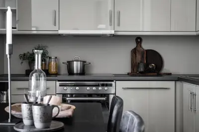 a kitchen with a stove and a table with a table at Høyfjellsgrend 962 in Trysil