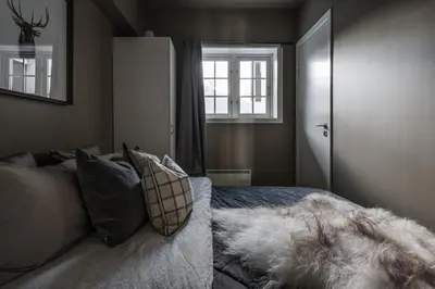 a bedroom with a bed and a window at Høyfjellsgrend 962 in Trysil