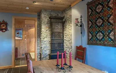 a dining room with a table with pink candles on it at Stunning Home In Rjukan With Wifi in Rjukan