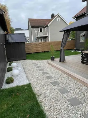 a backyard with a deck and a gazebo at Private house in Orkanger, 35 minutes from Trondheim in Orkanger