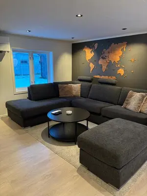 a living room with a couch and a table at Private house in Orkanger, 35 minutes from Trondheim in Orkanger