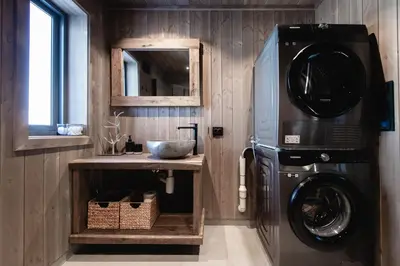 a kitchen with a washing machine and a sink at Chill cabin - fantastic view and nice hiking area in Aurdal
