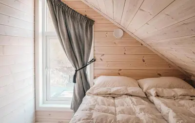 a bed in a room with a window at 4 Bedroom Amazing Home In Skånevik in Skånevik
