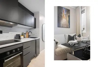 a kitchen and a living room with a sink and a counter at King bed - Behind Bryggen - Renovated des 23 in Bergen