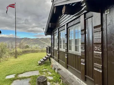 a building with windows on the side of it at Large cabin with spectacular views in Geilo in Geilo