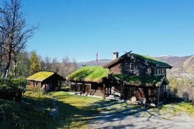 an old house with grass on its roof at Large cabin with spectacular views in Geilo in Geilo