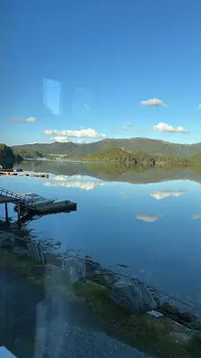 a view of a body of water with a pier at Handelsmannens hus ved Otnesbrygga, Valsøyfjord in Otnes