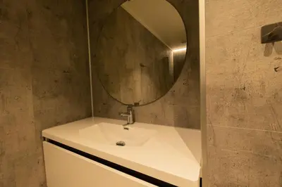 a bathroom with a sink and a mirror at Leilighet med utsikt i Loen in Stryn
