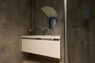 a bathroom with a white sink and a mirror at Leilighet med utsikt i Loen in Stryn