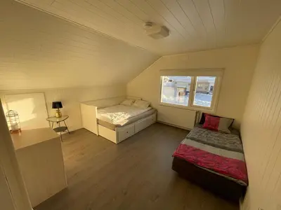 a small bedroom with a bed and a window at Spacious house in Trysil in Trysil