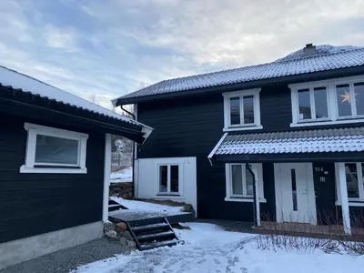 a black house with snow in front of it at 2 mannsbolig i Hemsedal sentrum, nær skianlegget - 3 sov og 7 sengeplasser in Hemsedal