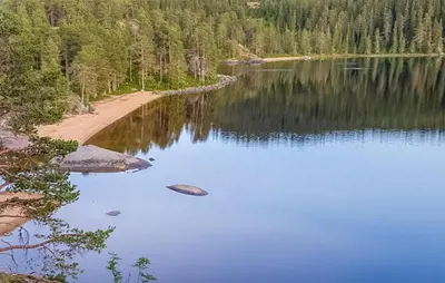a view of a lake with trees and a shoreline at Gorgeous Home In Rauland With Kitchen in Rauland