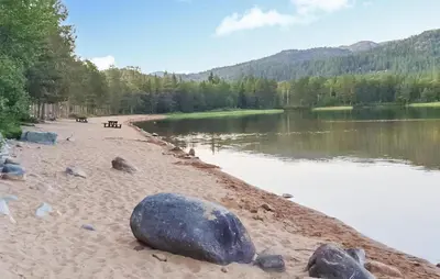 a sandy beach next to a body of water at Gorgeous Home In Rauland With Kitchen in Rauland