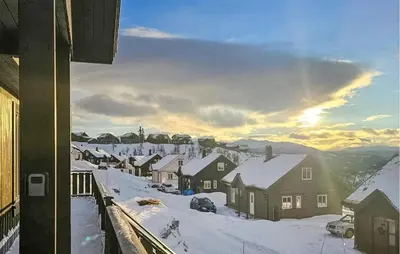 a town with snow covered houses and a train at Gorgeous Home In Rauland With Kitchen in Rauland