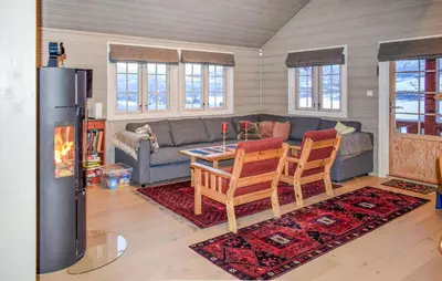 a living room with a couch and a table at Lovely Home In Geilo With Wifi in Geilo