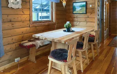 a wooden room with a table and chairs at Lovely Home In Stranda With Wifi in Stranda